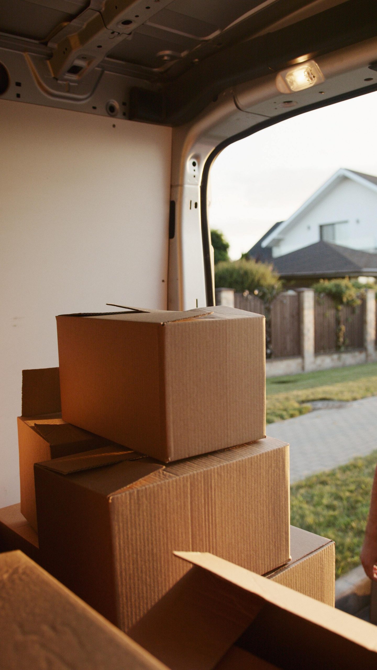 Moving truck with boxes in a neighborhood